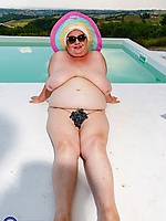 Thick mature granny showing hairy pussy and sunbathing nude