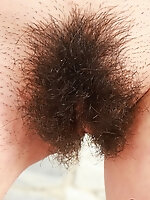 Teen Latina girl with hairy pussy posing by the pool