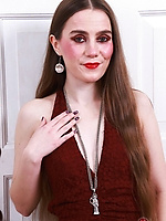 Young brunette flashes hairy pussy on couch and spreads wide nude