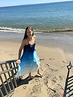 Glasses-wearing gilf strips down in office and fingers her hairy pussy