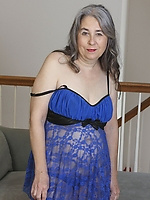 Old granny in blue demonstrating her hairy pussy